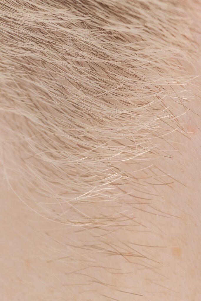 How Small Is an Atom?
Here’s something fun:
Hold up a single hair from your head. (Don’t pull it out—it’s okay if it’s already fallen.)

That hair might be super thin.
But guess what? You could fit about a million atoms across the width of that hair.

One million.
Side by side.
Just on that tiny line.

Now imagine how many atoms it takes to make your whole body!
You’re like a walking universe of atoms.