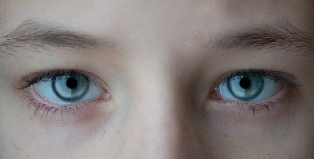 Behind your pupil is a clear lens, which focuses the light — kind of like zooming in with a camera. It bends the light just right so it lands on the back wall of your eye, called the retina.