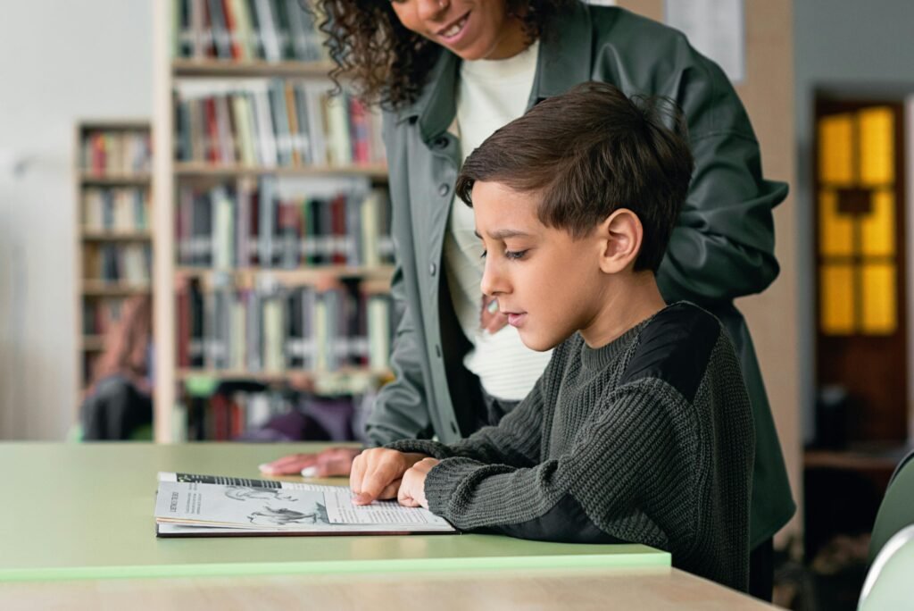 Pick a stable time and place. Right after dinner or right before bed works well because the day is slowing down. Keep the space simple, quiet, and cozy. Set a start cue, like a small chime or a short song. Use the same cue every day. Give two choices of what to read so your child feels a bit of control.